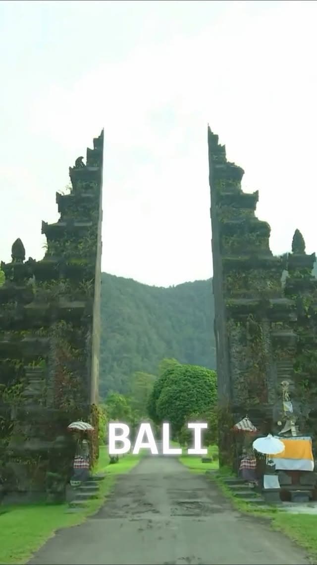 The Handara Gate in Bali, jungle hills framed between its two towers