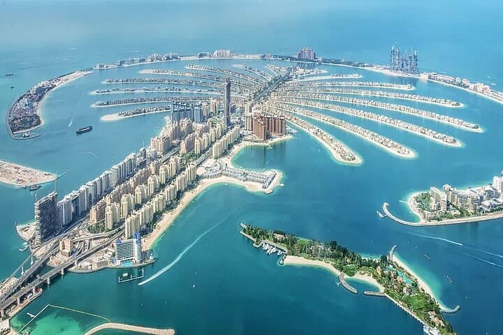 The Palm Jumeirah from the air, resorts along its fronds