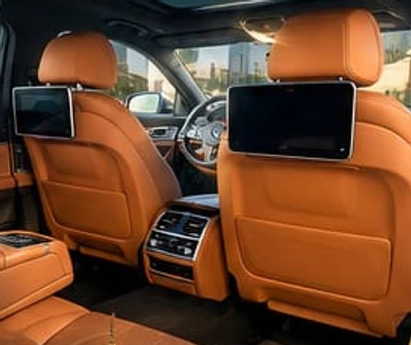 The rear of the 7 Series cabin, a screen on the back of each front seat and controls in the centre armrest