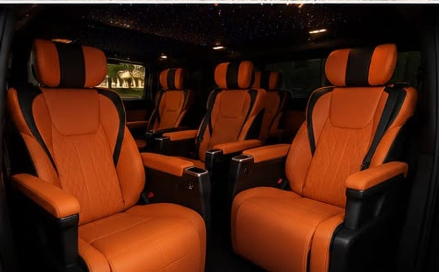 The Granvia's tan leather captain's chairs, two rows of two