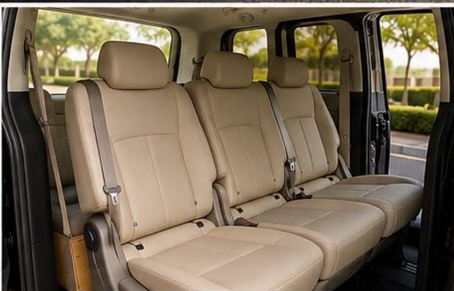 The Staria's middle row in beige leather, side door open