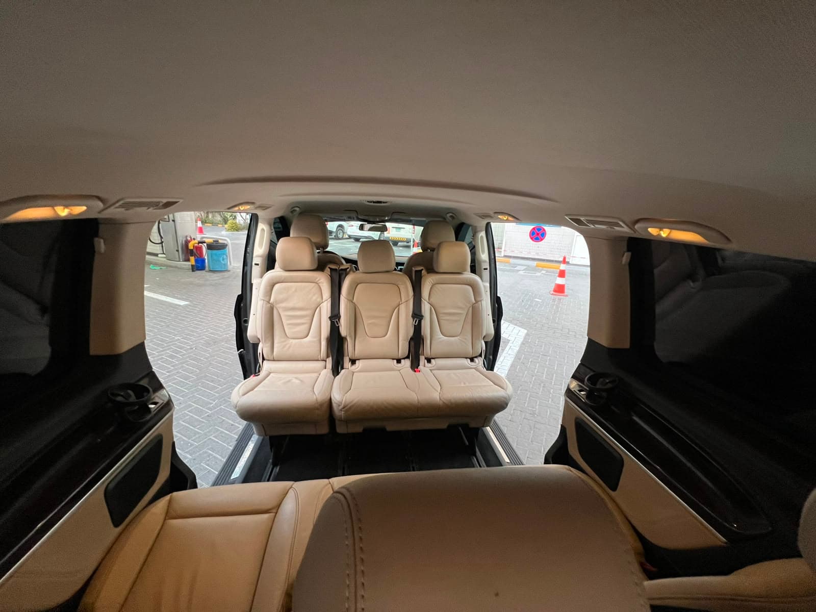 Both rear rows seen from the back, doors open on either side